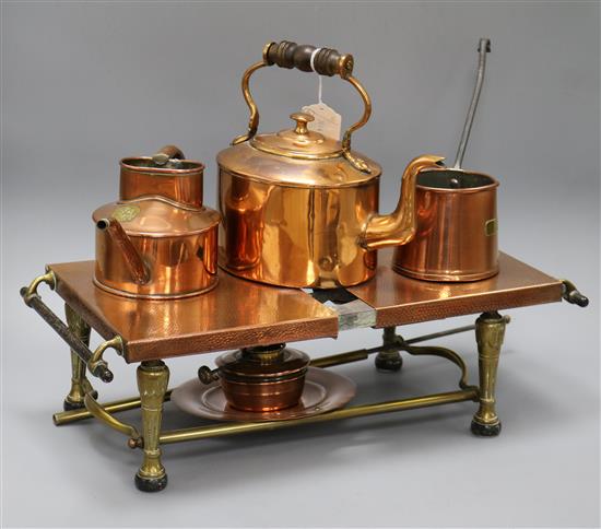 A copper warming stand and copper vessels